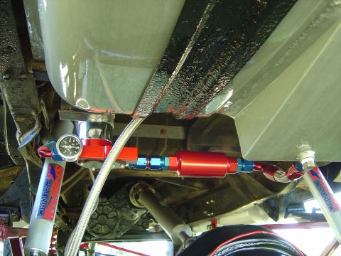 1978 Ford Bronco - Custom fuel filter and gauge assembly installed on a vehicle's undercarriage.