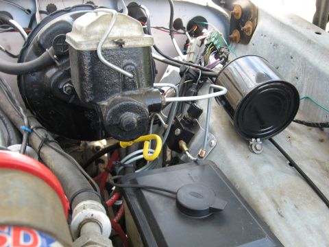 1979 Ford Bronco - Close-up of brake master cylinder and vacuum booster assembly in an engine bay.