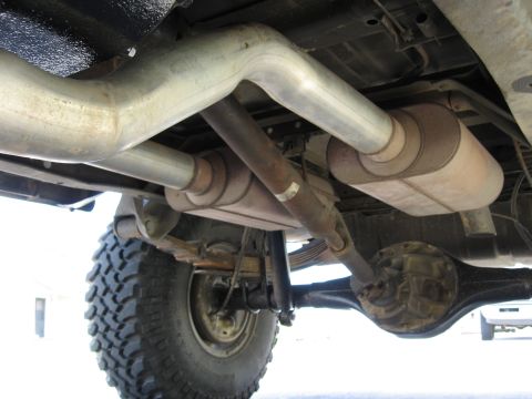 1979 Ford Bronco - Underside view of a 1979 Ford Bronco, highlighting the rear axle and dual exhaust system.