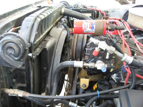 1979 Ford Bronco - Close-up view of an engine bay, the radiator, fan, and an MSD ignition coil. The Supermotors.net logo is visible at the bottom.