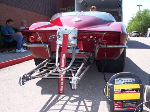 1972 Ford Ranchero - Drag car's rear end is prepped with a parachute and connected to a battery charger.