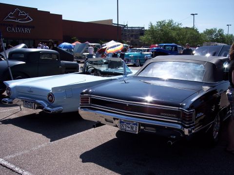 1972 Ford Ranchero - Two classic American convertibles, a 1967 Chevelle and a 1957 Thunderbird, are parked at an outdoor event.