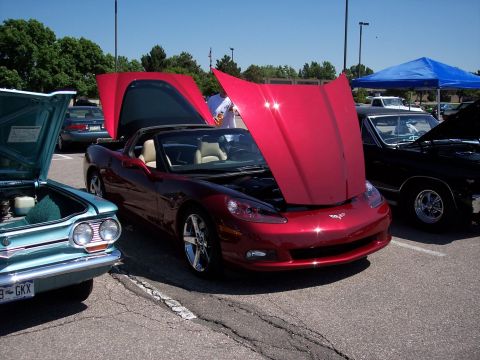 1972 Ford Ranchero - Three cars are parked outside with their hoods open on a sunny day.