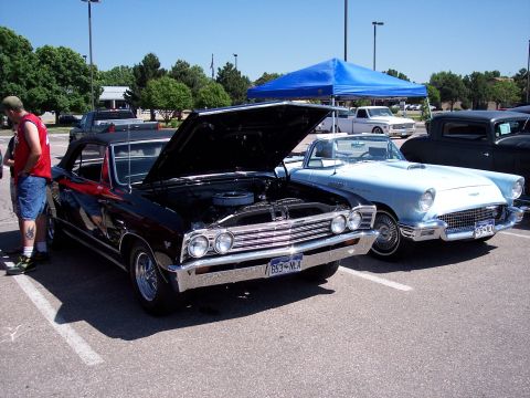 1972 Ford Ranchero - Two classic American convertibles, a black 1966 Chevelle and a light blue 1957 Thunderbird, are displayed at an outdoor event.