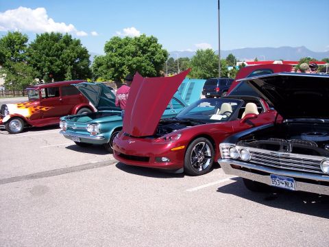 1972 Ford Ranchero - Cars are displayed with hoods open at an outdoor event, showing a variety of models.
