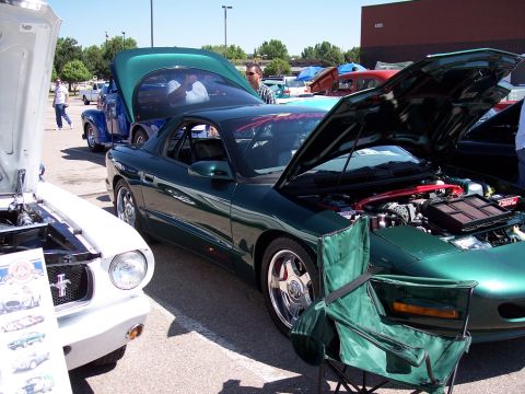 1972 Ford Ranchero - Cars are displayed with hoods open at an outdoor event.