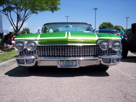 1972 Ford Ranchero - A custom green and white car with a prominent chrome grille and dual headlights is parked outdoors. The license plate reads CADYO COLORADO.