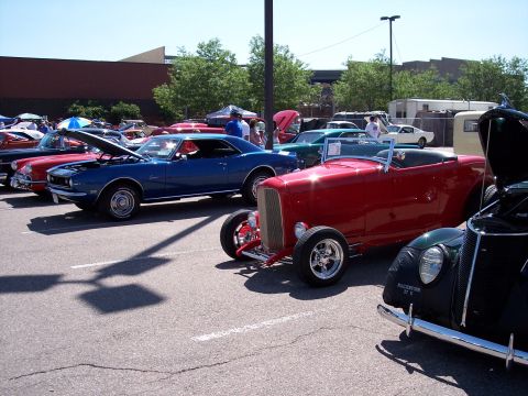 1972 Ford Ranchero - A variety of vintage vehicles are on display at an outdoor car show.
