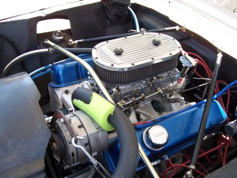 1972 Ford Ranchero - Close-up of a V8 engine, likely from a Ford vehicle, with visible dual carburetors and blue valve covers.