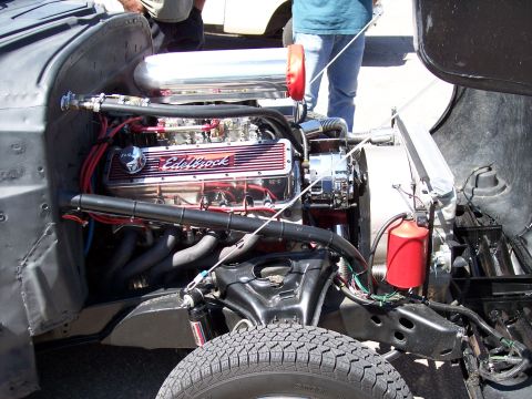 1972 Ford Ranchero - Custom engine bay features Edelbrock valve covers and a chrome air cleaner, with a red fluid reservoir visible.