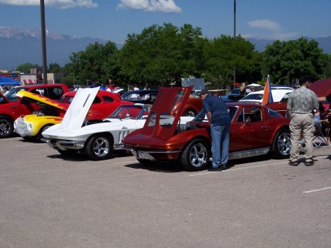 1972 Ford Ranchero - Several classic cars are displayed with their hoods open at an outdoor event.