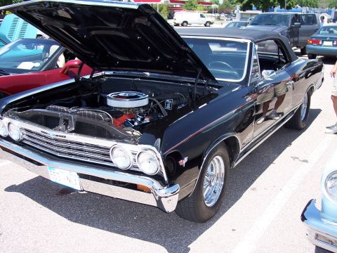 1972 Ford Ranchero - Black 1966 Chevrolet Chevelle convertible with hood open, parked outdoors.