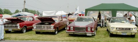 1976 Ford Ranchero - A red 1966 Ford Ranchero pickup truck is displayed with its hood open at an outdoor event.