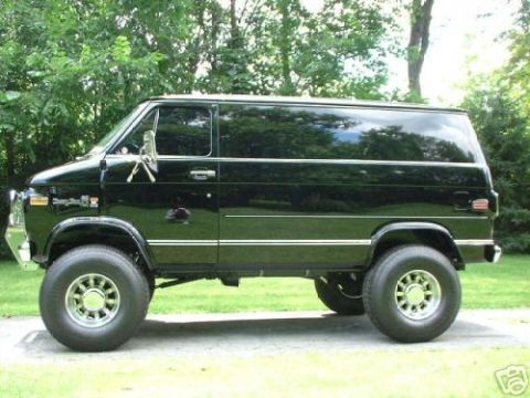 1978 Ford E250 - This lifted 1978 Ford E250 van features a black exterior with chrome accents and oversized wheels.