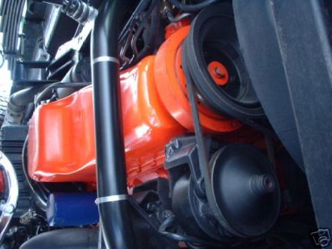 1978 Ford E250 - Close-up view of an engine bay, focusing on the oil pan and accessory drive components.