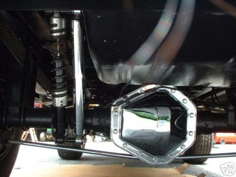 1978 Ford E250 - Close-up of a chrome differential cover on a vehicle's rear axle assembly.