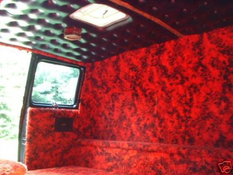1978 Ford E250 - Van interior with custom red shag carpet and a skylight.