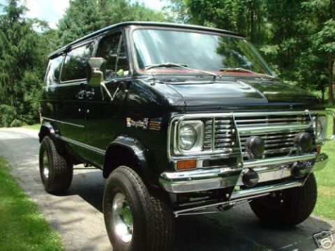 1978 Ford E250 - This van appears to be from the mid-to-late 1970s, with a distinctive grille and front bumper.