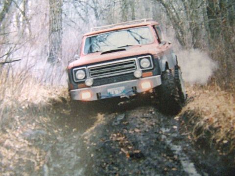 1988 Ford Bronco - Off-road driving scene an International Harvester Scout II.