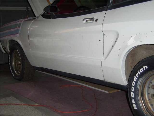 The stripes have been removed from the drivers side.