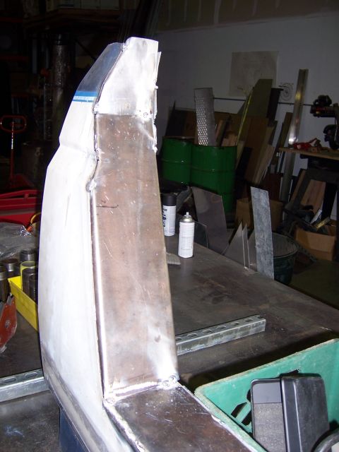 1991 Ford Bronco - Metal fabrication project on a workbench, with various tools and materials in the background.