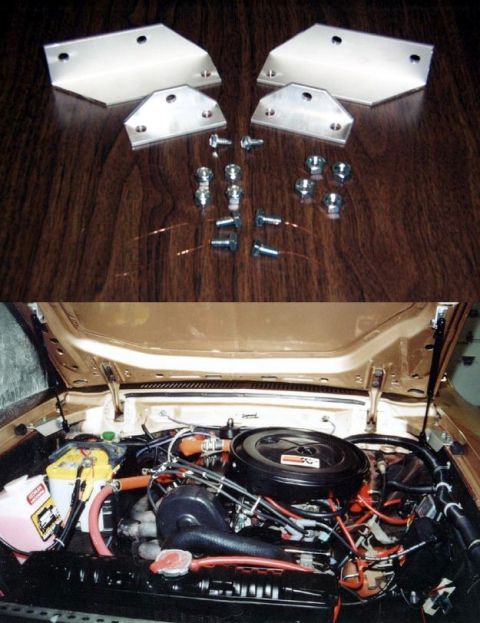 1978 Ford Mustang II - The engine bay of a car is shown, along with various metal parts and hardware laid out on a wooden surface.