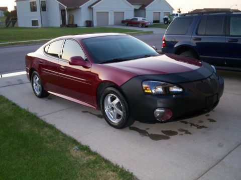 2004 Pontiac Grand Prix - 2004 Pontiac Grand Prix GT parked in a driveway with a car bra on the front.