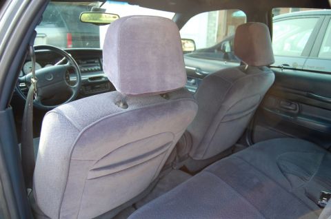 1985 Mercury Grand Marquis - Interior view of a car, likely a 1990s sedan, showing the front and rear seating areas.