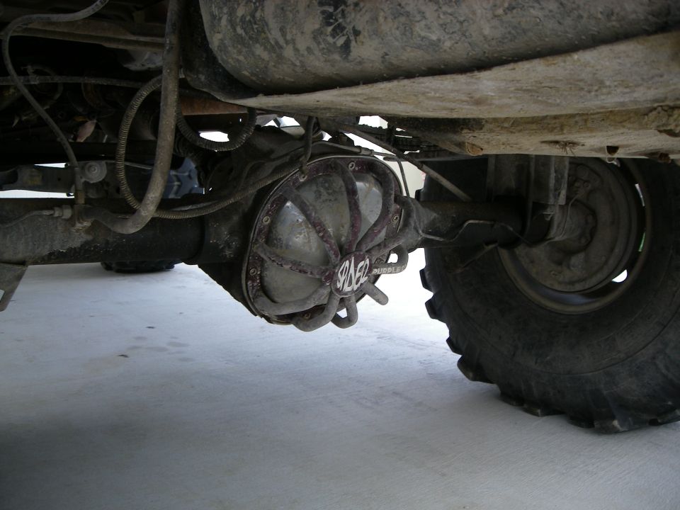 Aftermarket rear differential cover with 'Spicer' logo visible