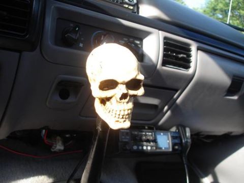 1996 Ford F-150 - A skull-shaped gear shift knob is the focal point of this truck's interior, with a CB radio visible.