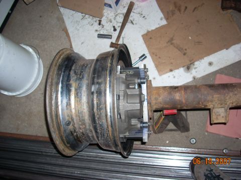 2000 Chevrolet Tahoe - Close-up of a vehicle's differential and axle assembly, with a wheel mounted. Date stamp visible: 06-14-2007.
