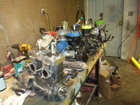 1995 Ford Mustang - Engine components are laid out on a workbench, suggesting a repair or assembly process.