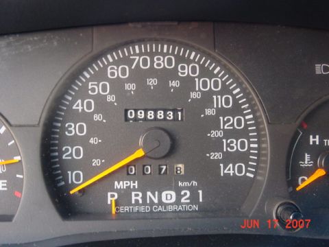 2003 Ford Crown Victoria - Interior view of a vehicle's dashboard, displaying the speedometer, odometer reading 98,831 miles, and gear selector.