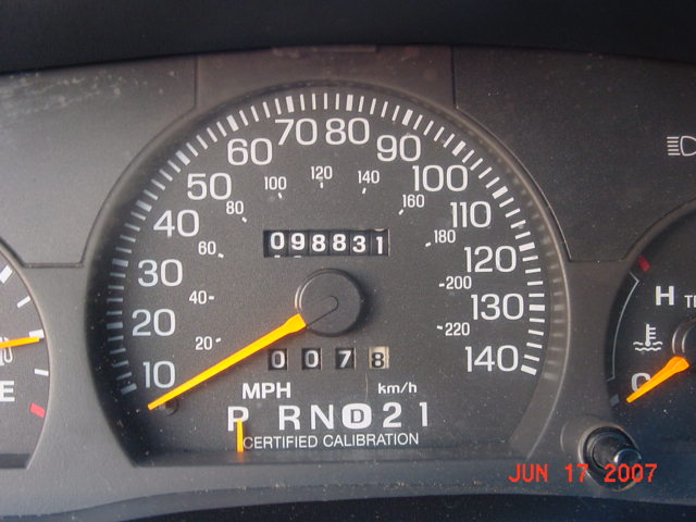 Speedometer and odometer of a vehicle showing 98,831 miles and P R N D 2 1 gear selection