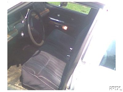 1991 Ford Crown Victoria - The interior of the car shows the front seats and dashboard area.
