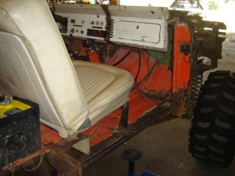 1992 Ford Bronco - Interior view of a disassembled 1978 Ford Bronco, revealing its internal components and orange floor.