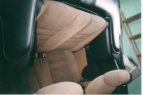 1991 Ford LTD Crown Victoria - Interior view of a vehicle's tan cloth seats and headliner, accented by black trim.