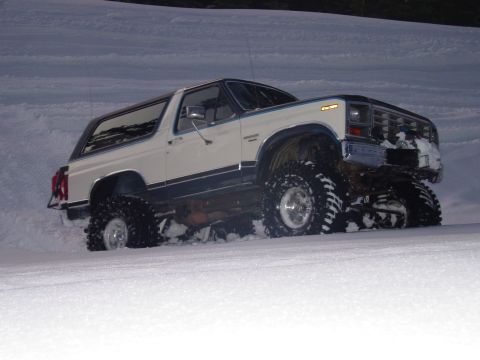 1986 Ford Bronco - This 1986 Ford Bronco is equipped with large off-road tires, making it well-suited for snowy conditions.