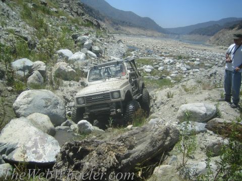1987 Suzuki Samurai - A Suzuki Samurai tackles a challenging off-road course in a dry riverbed.