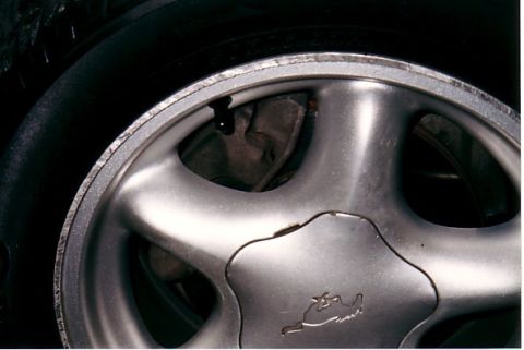 1991 Ford LTD Crown Victoria - Curb rash on front right wheel