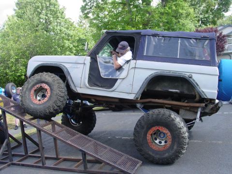 1973 Ford Bronco - This 1973 Ford Bronco is shown with its front wheels on a metal ramp, highlighting its off-road capabilities.