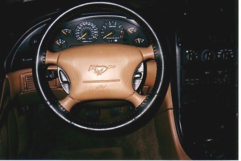 1991 Ford LTD Crown Victoria - Interior of a 1994 Ford Mustang, the steering wheel and instrument cluster.