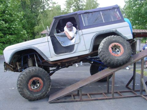 1973 Ford Bronco - A modified 1973 Ford Bronco is positioned on a ramp, its off-road capabilities.