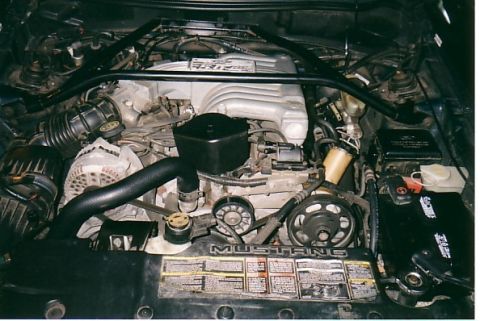 1991 Ford LTD Crown Victoria - Close-up view of the engine compartment, highlighting the V8 engine and associated components.