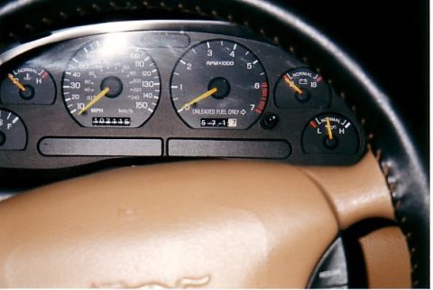 1991 Ford LTD Crown Victoria - The odometer shows 102,115 miles on this vehicle's dashboard gauges.
