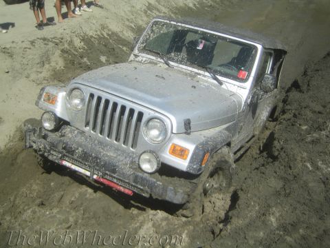 1987 Suzuki Samurai - Jeep Wrangler struggling to get traction in thick mud.