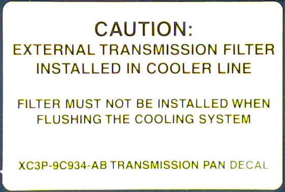 Caution decal for external transmission filter in cooler line, part XC3P-9C934-AB