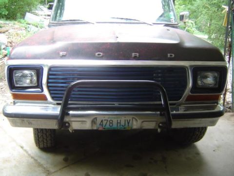 1979 Ford Bronco - Front view of a 1979 Ford Bronco, a blue grille and a black bull bar.