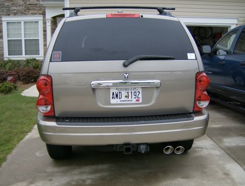 2004 Dodge Durango - The rear of a 2004 Dodge Durango is shown, dual exhaust pipes and a roof rack.