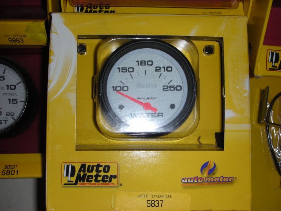 Auto Meter water temperature gauge in yellow packaging